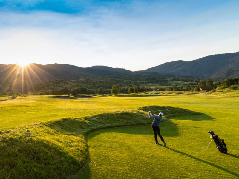 Golfer hitting from fairway